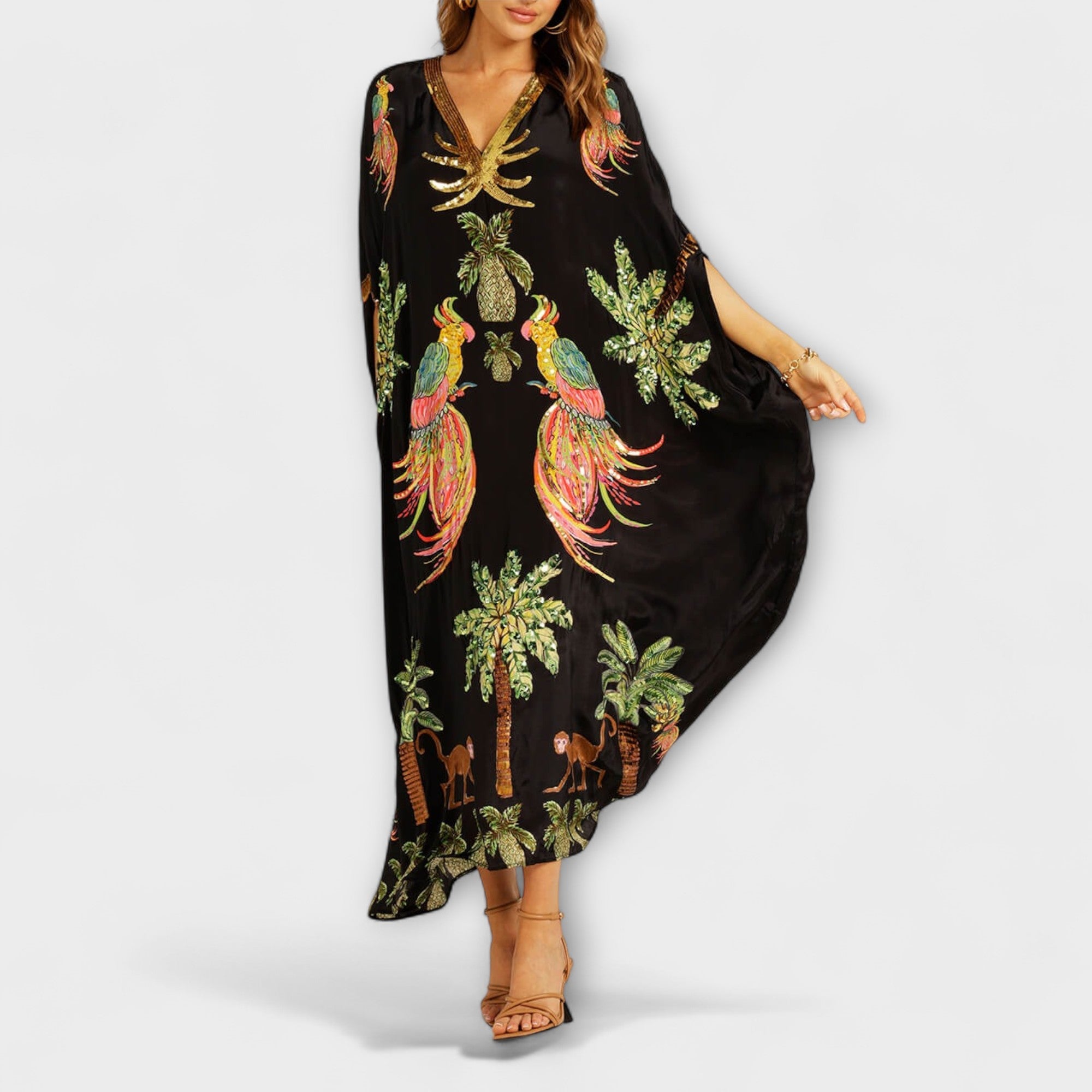 Linda - Iøynefallende kjole med av-shoulder design og kokosnøtttre trykk